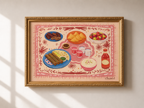 Decorative wall art with a gold frame showing illustrations of food on a pink background.
